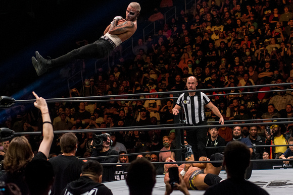 Darby Allin delivering with the Coffin Drop to Billy Gunn.